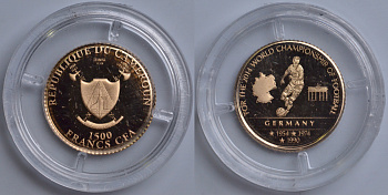 КАМЕРУН 1500 ФРАНКОВ 2014 ЧЕМПИОНАТ МИРА ПО ФУТБОЛУ - 2014, ГЕРМАНИЯ - ГОДЫ ЧЕМПИОНСТВА, ИГРОК С МЯЧОМ НА ФОНЕ КАРТЫ ГЕРМАНИИ И БРАНДЕНБУРГСКИХ ВОРОТ KM NEW золото PROOF 00-000-00